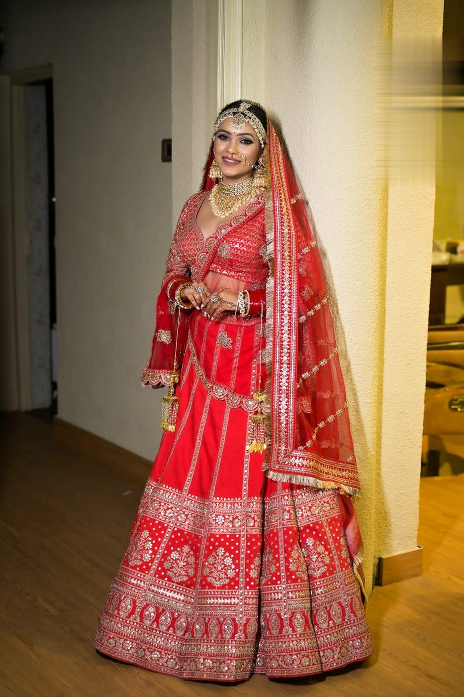 Red bridal lehenga, regal full-length portrait