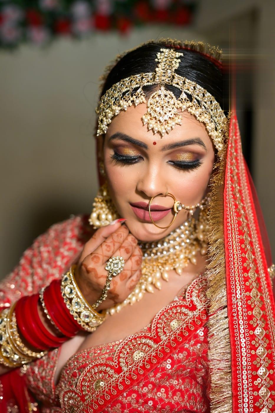 Golden glam bridal makeup with shimmering eyes by Rare Salon, Dehradun