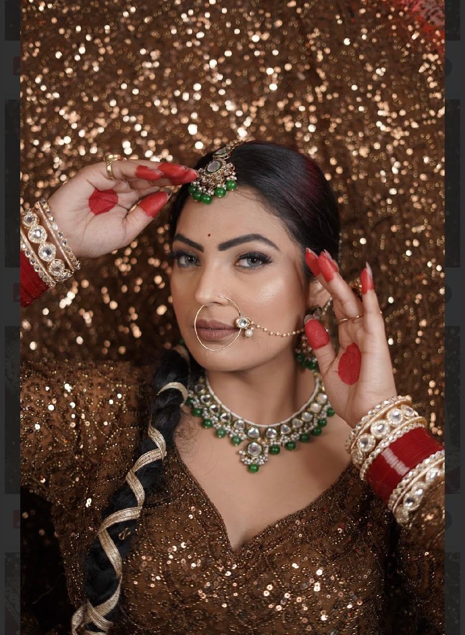 Royal maroon bridal look with emerald jewellery by Rare Salon