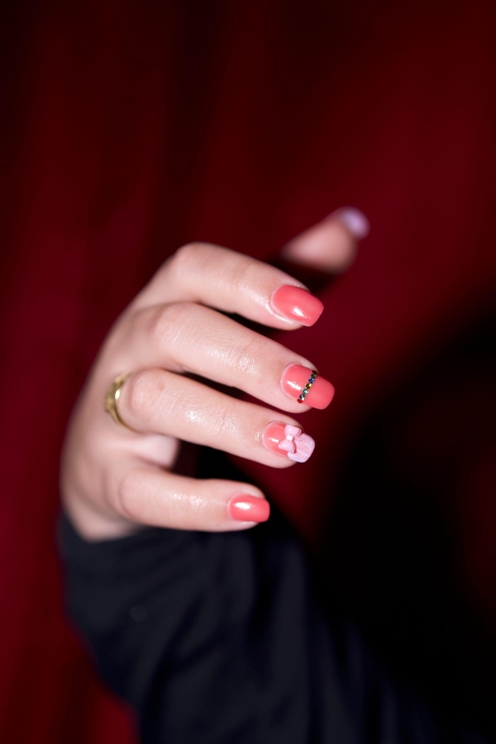 Red and white floral hand-painted manicure
