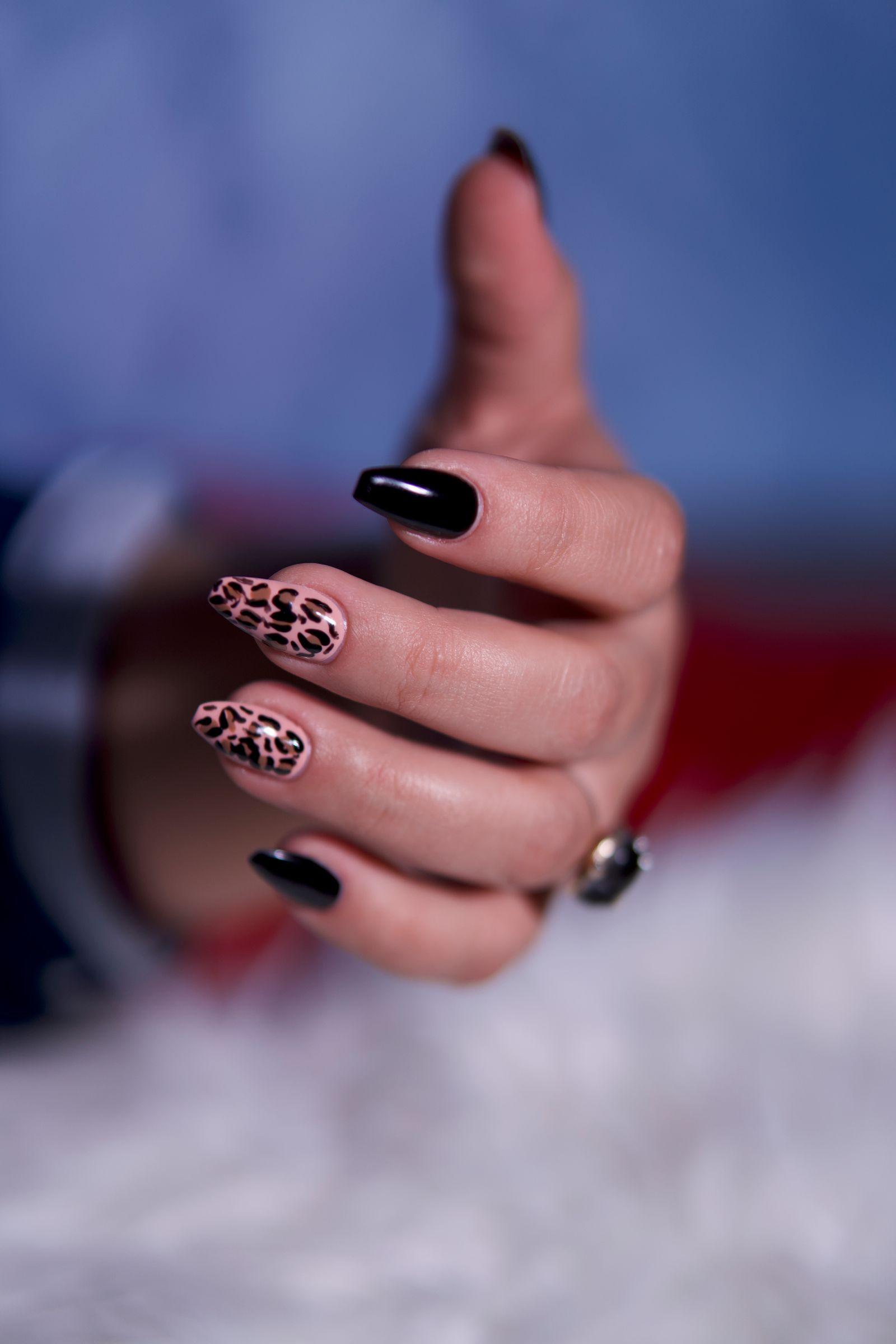 Nude nails with gold leopard-print accents